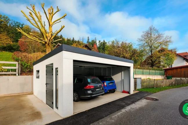 dve autá vo vnútri garáže